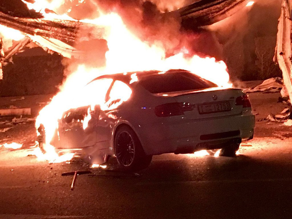 An on fire BMW has Caused a Complete Destruction of a House